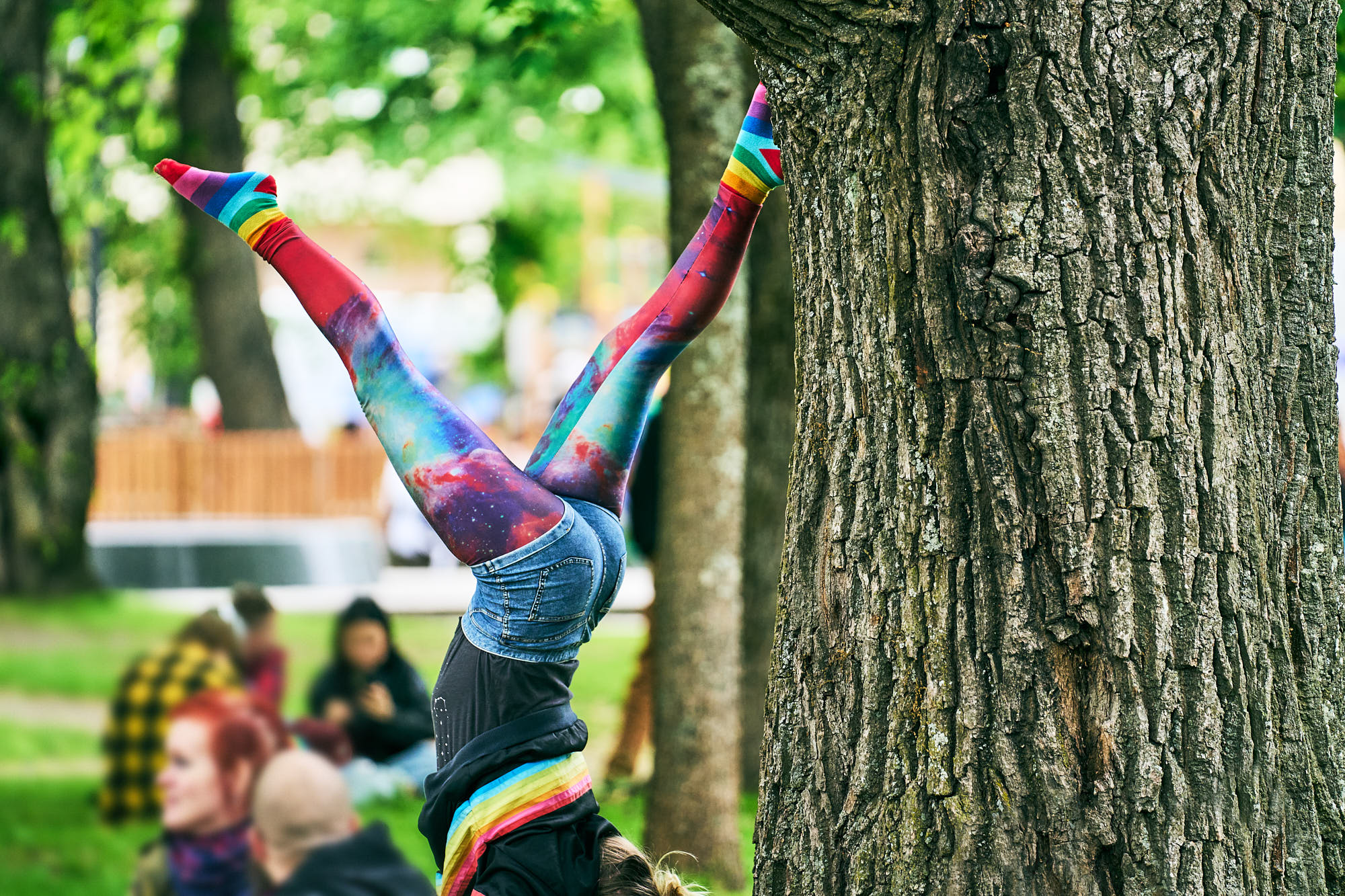 A circus artist in the park.